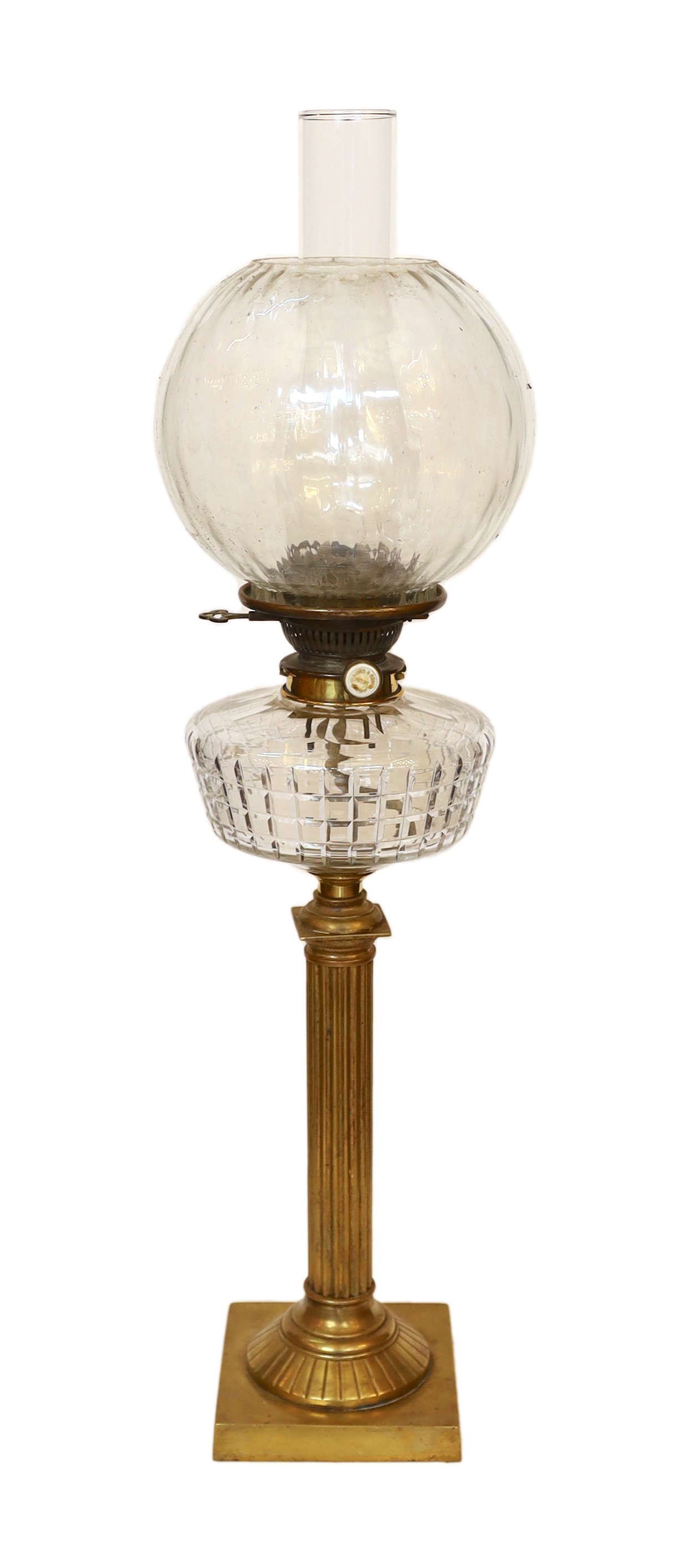 A late Victorian brass and cut glass oil lamp with Hinks and Son mechanism, spiral fluted globe and flue, height overall 74cm